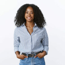 Charismatic cheerful attractive african american woman curly haircut wearing shirt holding hands pockets confident outgoing smiling, talking pleasant conversation, feeling self-assured relaxed.
