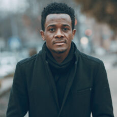 handsome man walking  in autumn city